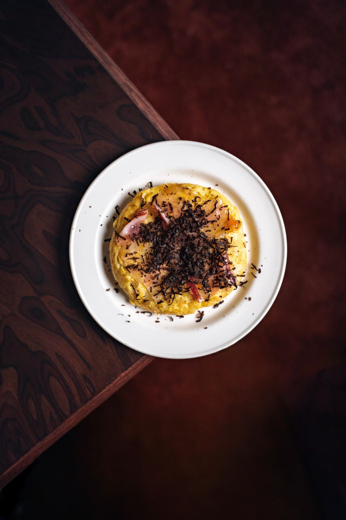 Tortilla topped with shaved truffle